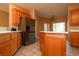 Open concept kitchen with stainless steel refrigerator and center island at 3567 Cottage Stream Ct, Laughlin, NV 89029