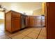 Kitchenette area shows dishwasher, wooden cabinets and light colored countertop at 3567 Cottage Stream Ct, Laughlin, NV 89029