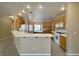Bright, open kitchen with a breakfast bar, tile flooring, and modern appliances at 3567 Cottage Stream Ct, Laughlin, NV 89029