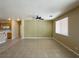 A cozy living area with tile floors, adjacent to the kitchen, bathed in natural light at 3567 Cottage Stream Ct, Laughlin, NV 89029