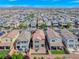 A high-angle view showing a suburban neighborhood with multiple homes with manicured lawns and patios at 358 Badinerie St, Henderson, NV 89011