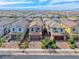 A high angle shot showing a well-developed suburban neighborhood with landscaped yards and similar house designs at 358 Badinerie St, Henderson, NV 89011