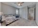 Cozy bedroom with neutral walls, carpet, ceiling fan, and a comfortable bed, offering a relaxing retreat at 358 Badinerie St, Henderson, NV 89011