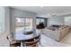Dining area features a unique round table and chairs with access to outdoor space at 358 Badinerie St, Henderson, NV 89011