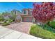 Attractive two-story home with desert landscaping, a tile roof, and a two-car garage at 358 Badinerie St, Henderson, NV 89011