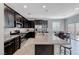 Spacious kitchen features an island with bar seating and stainless steel appliances at 358 Badinerie St, Henderson, NV 89011