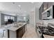 Well-lit kitchen offers an island with bar seating and an open floor plan at 358 Badinerie St, Henderson, NV 89011