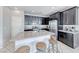 Modern kitchen features stainless steel appliances, granite countertops, and a breakfast bar at 358 Badinerie St, Henderson, NV 89011