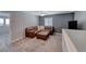 Loft featuring a comfy L-shaped sofa, ceiling fan and gray walls at 358 Badinerie St, Henderson, NV 89011