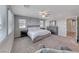 Serene main bedroom with neutral colors, plush carpeting, and abundant natural light at 358 Badinerie St, Henderson, NV 89011