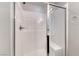Bright bathroom shower featuring white subway tile, glass door, shower head and convenient built-in bench at 358 Badinerie St, Henderson, NV 89011