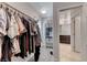 Walk-in closet with shelving and rods for storage, adjacent to the bathroom at 358 Badinerie St, Henderson, NV 89011