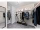Organized walk-in closet with a mirror and shelving units and ample storage space at 358 Badinerie St, Henderson, NV 89011