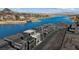 Aerial view of contemporary waterfront property and golf course, nestled near a lake at 36 Lakefront Dr, Henderson, NV 89011