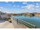 Enjoy the beautiful lake view from this balcony, featuring a sleek railing and outdoor plants at 36 Lakefront Dr, Henderson, NV 89011