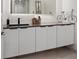 Sleek bathroom with dark countertop vanity, modern faucet, and minimalistic decor providing a modern look at 36 Lakefront Dr, Henderson, NV 89011