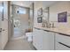 Modern bathroom with a glass-enclosed shower and sleek fixtures with views out of a large window at 36 Lakefront Dr, Henderson, NV 89011