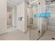Contemporary bathroom with a frameless glass shower showcasing mountain views and stylish fixtures at 36 Lakefront Dr, Henderson, NV 89011