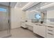 Modern bathroom with double vanity, walk-in shower, and sleek, minimalist design at 36 Lakefront Dr, Henderson, NV 89011