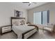 Bright bedroom featuring modern decor, a comfortable bed, and a large window at 36 Lakefront Dr, Henderson, NV 89011