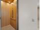 Interior of an elevator showing wood panels, control buttons, and hand rail, providing accessibility within the home at 36 Lakefront Dr, Henderson, NV 89011