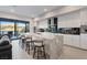 Modern kitchen with white cabinetry, a large island with seating and stainless steel appliances at 36 Lakefront Dr, Henderson, NV 89011