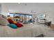 Bright main bedroom with large windows and a view, complete with a television and seating area at 36 Lakefront Dr, Henderson, NV 89011