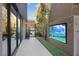 Private outdoor space featuring tiled flooring, landscape design, and a built-in television for outdoor relaxation at 36 Lakefront Dr, Henderson, NV 89011
