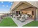 Stylish outdoor living area with comfortable seating, firepit, grassy space, and convenient indoor access at 36 Lakefront Dr, Henderson, NV 89011