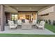 Beautiful outdoor patio with comfortable seating and a fire pit for cozy evenings at 36 Lakefront Dr, Henderson, NV 89011