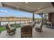 Enjoy beautiful water views from this cozy patio with comfortable seating and spiral staircase at 36 Lakefront Dr, Henderson, NV 89011