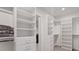 Spacious walk-in closet with custom shelving, drawers, and ample storage space at 36 Lakefront Dr, Henderson, NV 89011