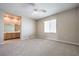 Large neutral bedroom with carpet flooring, ceiling fan and connecting bathroom at 3636 Chelsea Gardens Dr, Las Vegas, NV 89135