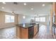 Large kitchen with a large island and black appliances at 3636 Chelsea Gardens Dr, Las Vegas, NV 89135