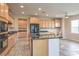 Open-concept kitchen with granite countertops and light wood cabinets at 3636 Chelsea Gardens Dr, Las Vegas, NV 89135