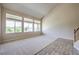 Spacious living room featuring large windows and neutral carpet at 3636 Chelsea Gardens Dr, Las Vegas, NV 89135
