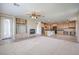 Open-concept living area featuring living room, fireplace, kitchen and dining at 3636 Chelsea Gardens Dr, Las Vegas, NV 89135