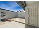 Backyard showing a gated wall entry with concrete pad and rock landscaping area at 3924 Blackford Pl, Las Vegas, NV 89102