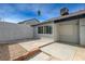 Backyard patio with concrete and rock landscaping, plus secure gated entry at 3924 Blackford Pl, Las Vegas, NV 89102
