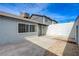 A spacious backyard area showing a concrete patio, rock landscaping, and privacy wall at 3924 Blackford Pl, Las Vegas, NV 89102