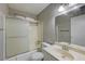 Bathroom features a shower-tub combo, vanity, and mirror at 3924 Blackford Pl, Las Vegas, NV 89102
