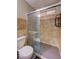 Bathroom with dark tile, glass shower, and shower caddy at 3924 Blackford Pl, Las Vegas, NV 89102