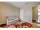 Bedroom featuring neutral walls, tile floors, and floral rug at 3924 Blackford Pl, Las Vegas, NV 89102