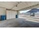 Carport interior with storage, showing blue trash cans and view of surrounding neighborhood at 3924 Blackford Pl, Las Vegas, NV 89102