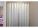 White folding doors covering a laundry area with white washer and dryer units at 3924 Blackford Pl, Las Vegas, NV 89102