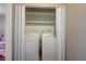 Laundry area featuring white washer and dryer units behind folding doors at 3924 Blackford Pl, Las Vegas, NV 89102