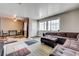 Spacious living room featuring large windows and access to the dining room at 3924 Blackford Pl, Las Vegas, NV 89102