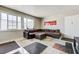 Cozy living room features tile floors, neutral paint, and a comfortable sectional sofa at 3924 Blackford Pl, Las Vegas, NV 89102