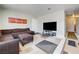 Comfortable living room featuring a large sectional sofa and natural light at 3924 Blackford Pl, Las Vegas, NV 89102