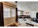 Comfortable living room featuring a large sectional sofa and natural light at 3924 Blackford Pl, Las Vegas, NV 89102